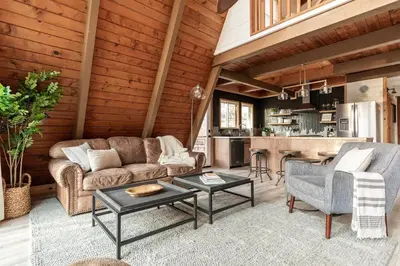 a living room with a couch and a table at Acorn Falls, Bass Lake, Ca in Bass Lake