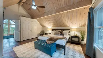 a bedroom with a bed and a wooden ceiling at Retreat with Lake Access Deck Modern Interior Agate Peak by Avantstay in Carnelian Bay