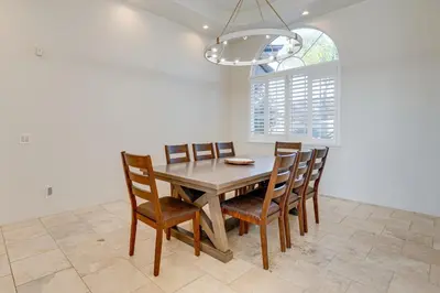 a dining room with a wooden table and chairs at Luxury Pilot Hill Estate on an 800-Acre Vineyard in Pilot Hill