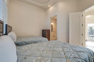 a bedroom with two beds and a window at Luxury Pilot Hill Estate on an 800-Acre Vineyard in Pilot Hill