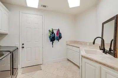 a kitchen with a sink and a white door at Luxury Pilot Hill Estate on an 800-Acre Vineyard in Pilot Hill