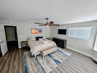 a bedroom with a bed and a ceiling fan at 3 Bedrooms - Game Room - On the water in Discovery Bay