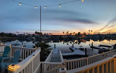 a view of a marina at dusk at 3 Bedrooms - Game Room - On the water in Discovery Bay