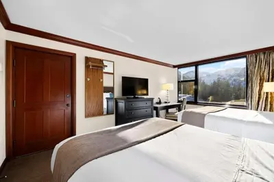 a hotel room with two beds and a large window at Studio Suite 2 Queen Beds Mountain View in Tahoe City