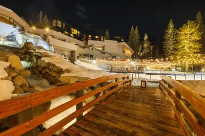 a wooden boardwalk leading to a ski resort at night at Studio Suite 2 Queen Beds Mountain View in Tahoe City