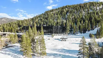 a snow covered mountain with trees and a forest at 6th Floor Mountain View Room - Fireplace Suite in Tahoe City