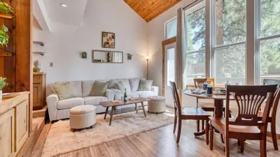 a living room with a couch and a table at Cozy Tahoe Townhome w Fireplace Balcony Quick Access to Trails Lake Cubana - Dollar Hill by AvantStay in Tahoe City