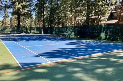 a tennis court with a net on it at Summit 65 in Mammoth Lakes