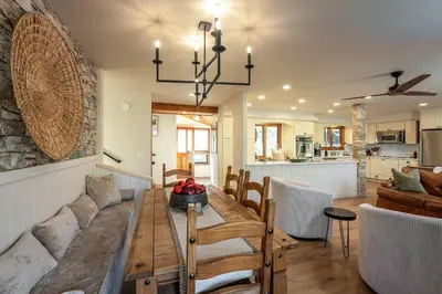a dining room and living room with a table and chairs at Prime Sequoia Stay Pool Hot Tub Sauna Views in Three Rivers