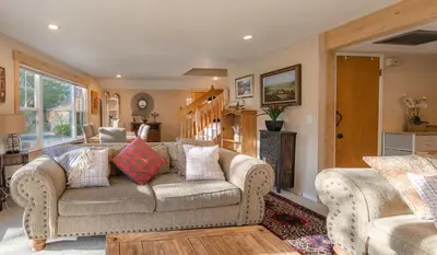a living room with a couch with pillows on it at The Ale Arths Retreat for 8 in South Lake Tahoe