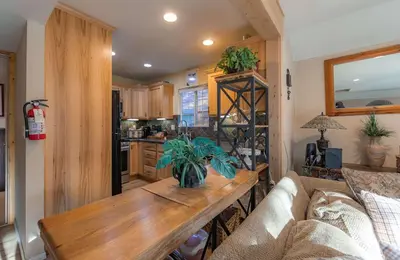 a living room with a couch and a table in a kitchen at The Ale Arths Retreat for 8 in South Lake Tahoe