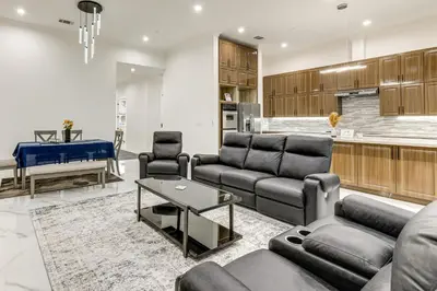 a living room with couches and a table and a kitchen at Sip, Dine and Unwind Spacious Lodi Gem with Patio! in Lodi