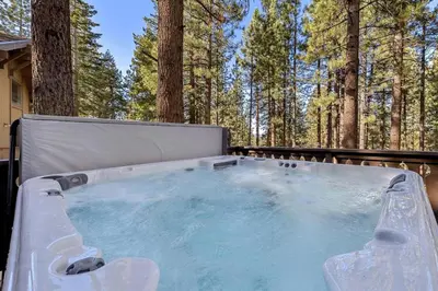 a hot tub in the middle of the woods at 1192 Timber Lane home in South Lake Tahoe