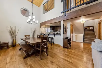 a dining room and living room with a table and chairs at 1192 Timber Lane home in South Lake Tahoe