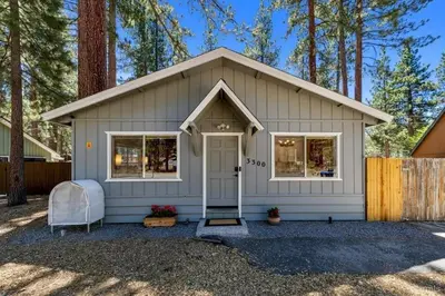 a white shed with a door and windows at 3300 Cape Horn home in South Lake Tahoe