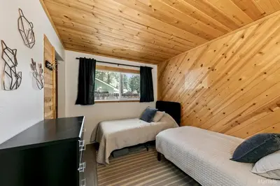 a bedroom with two beds and a desk in a room at 3300 Cape Horn home in South Lake Tahoe