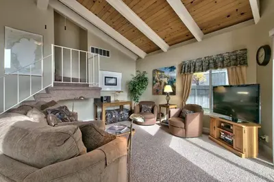 a living room with a couch and a flat screen tv at 1673 Venice Drive home in South Lake Tahoe