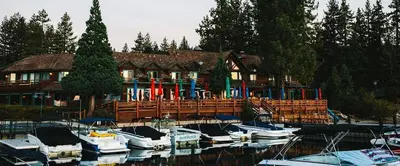 a house with boats docked in front of a marina at Fred's Retreat cabin in Homewood