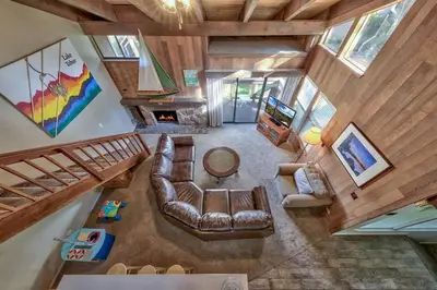 an overhead view of a living room with a couch and a television at Lakefront Townhome in South Lake Tahoe in South Lake Tahoe