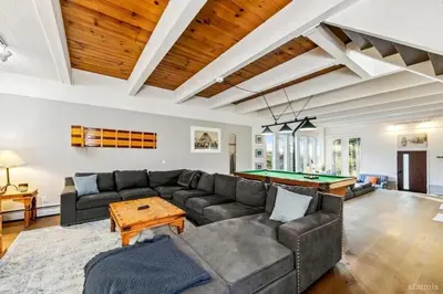 a living room with a couch and a pool table at 3748 Terrace Drive home in South Lake Tahoe