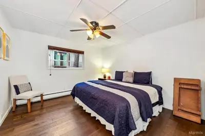 a bedroom with a bed and a ceiling fan at 3748 Terrace Drive home in South Lake Tahoe