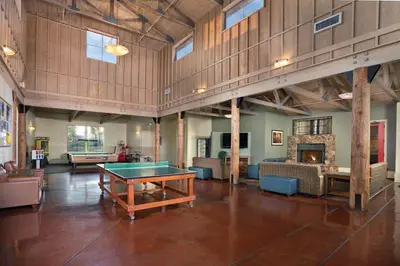 a large room with a ping pong table in it at Wyndham Angels Camp- 1 BR- Apartment with Resort Access in Angels Camp