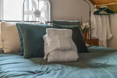 a pile of towels sitting on top of a bed at HNC0691 - Tramway Treat home in Stateline