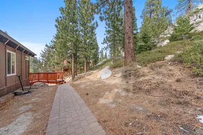 a walkway next to a house with trees at HNC0691 - Tramway Treat home in Stateline