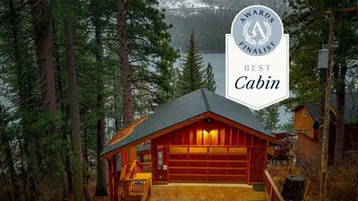 a cabin with a sign that reads best cabin at Cozy Donner Lake Cabin w Kayaks Forest Views Fireplace Quick Ski Resort Access Donner Lake Refuge by AvantStay in Truckee