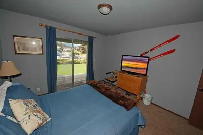 a bedroom with a bed and a desk with a computer at 584 Alpine Drive home in South Lake Tahoe