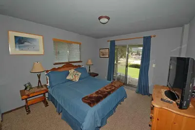 a bedroom with a bed and a flat screen tv at 584 Alpine Drive home in South Lake Tahoe