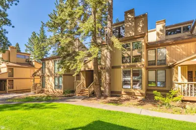 an exterior view of a large house with a yard at Kings Beach Luxe in Kings Beach