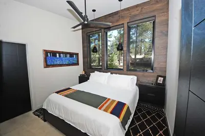 a bedroom with a large white bed and a window at 676 El Dorado Avenue home in South Lake Tahoe