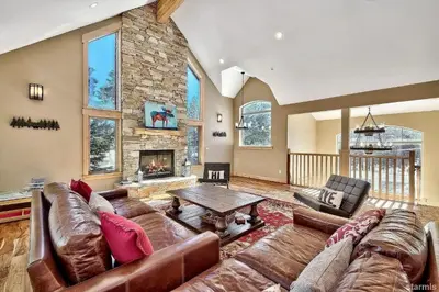 a large living room with a couch and a fireplace at 539 Wintoon Drive home in South Lake Tahoe