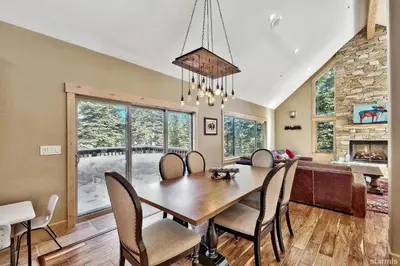 a dining room with a table and chairs at 539 Wintoon Drive home in South Lake Tahoe