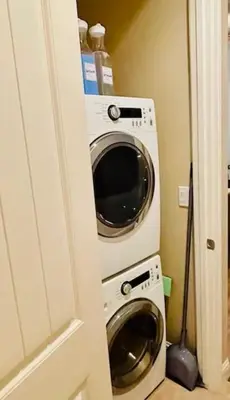 a washing machine and a washer and dryer in a room at Casa Cortez in Visalia