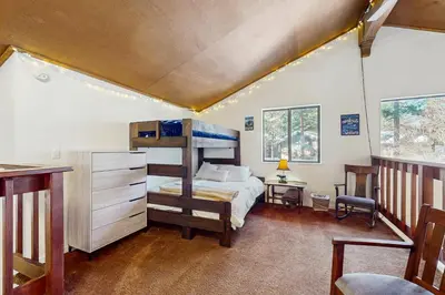 a bedroom with a bunk bed in a house at Pine Hill Hideaway in South Lake Tahoe