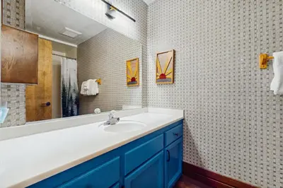 a bathroom with a sink and a mirror at Pine Hill Hideaway in South Lake Tahoe