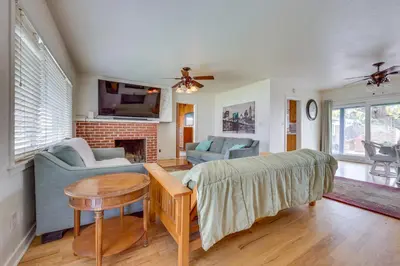 a living room with a couch and a table at Hot Tub, Patio and Outdoor Games at Visalia Home in Visalia
