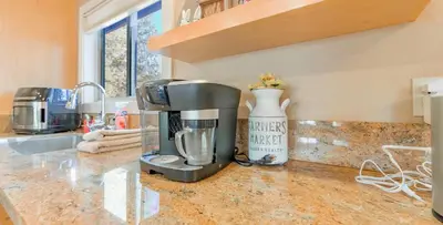 a kitchen with a coffee maker on a counter at Bakersfield Basecamp - Meyers Escape in South Lake Tahoe
