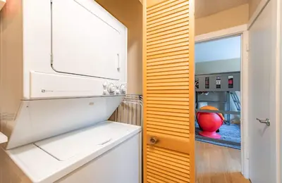 a kitchen with a white refrigerator and a window at Bakersfield Basecamp - Meyers Escape in South Lake Tahoe