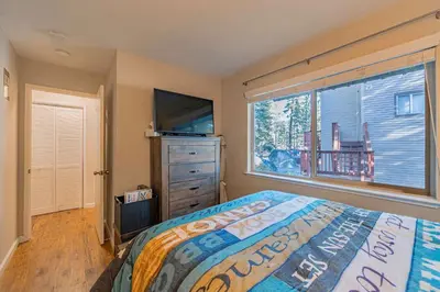 a bedroom with a bed and a large window at Spooner Summit For 6ppl in Zephyr Cove