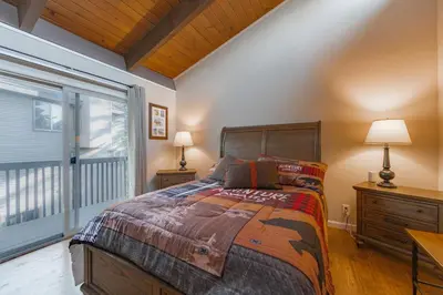a bedroom with a bed and a large window at Spooner Summit For 6ppl in Zephyr Cove