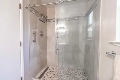 a shower with a glass door in a bathroom at Spooner Summit For 6ppl in Zephyr Cove