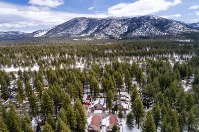 an aerial view of a resort with snow covered mountains at Meadow Chalet townhouse in South Lake Tahoe