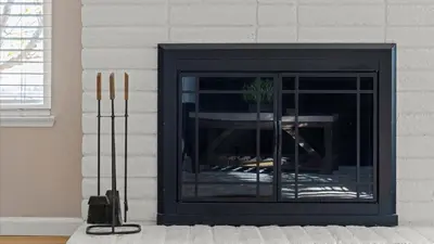 a fireplace in a living room with a black at NEW Cityside Stay 3BR Family Retreat Near DT with Patio in Reno