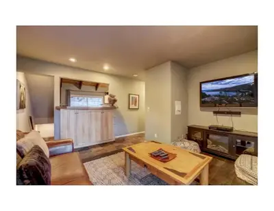 a living room with a couch and a table at Tramway near Heavenly/ Dogs OK/ New Heating & Air in Stateline