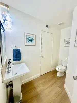 a bathroom with a sink and a toilet at Tranquil Getaway in Fresno