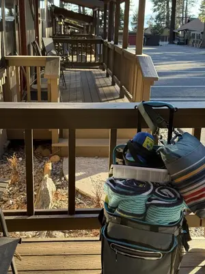 a piece of luggage sitting in front of a bench at Lakeside Condo Close to Slopes Excellent Location in Tahoe Vista