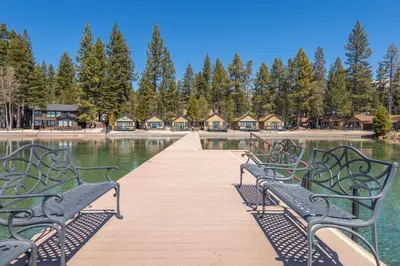 a wooden boardwalk with benches in front of the water at Lakeside Condo Close to Slopes Excellent Location in Tahoe Vista